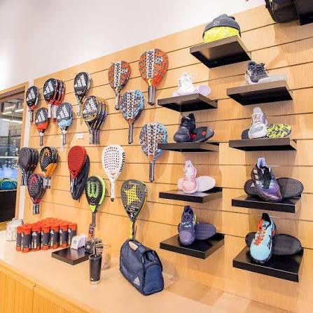 Pro shop wall with rackets, shoes and gear